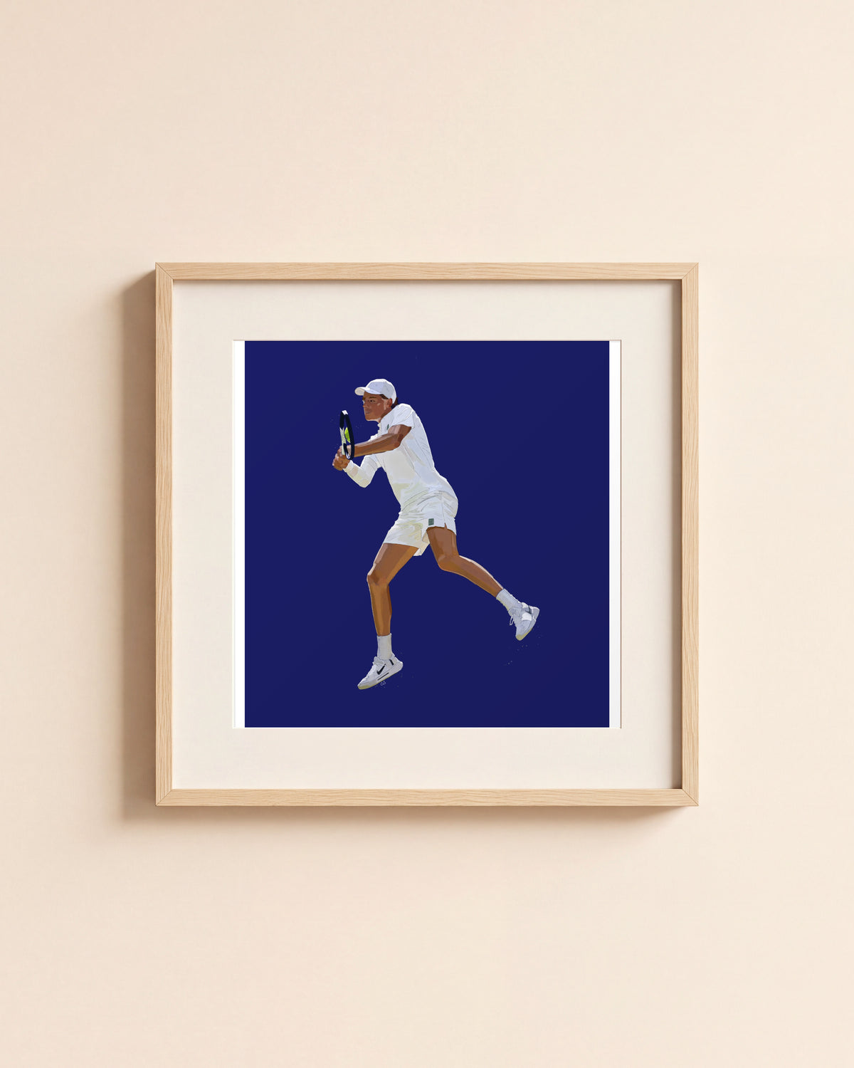 Jannik giclée art print in a light oak frame with a white mat, hanging on a cream wall