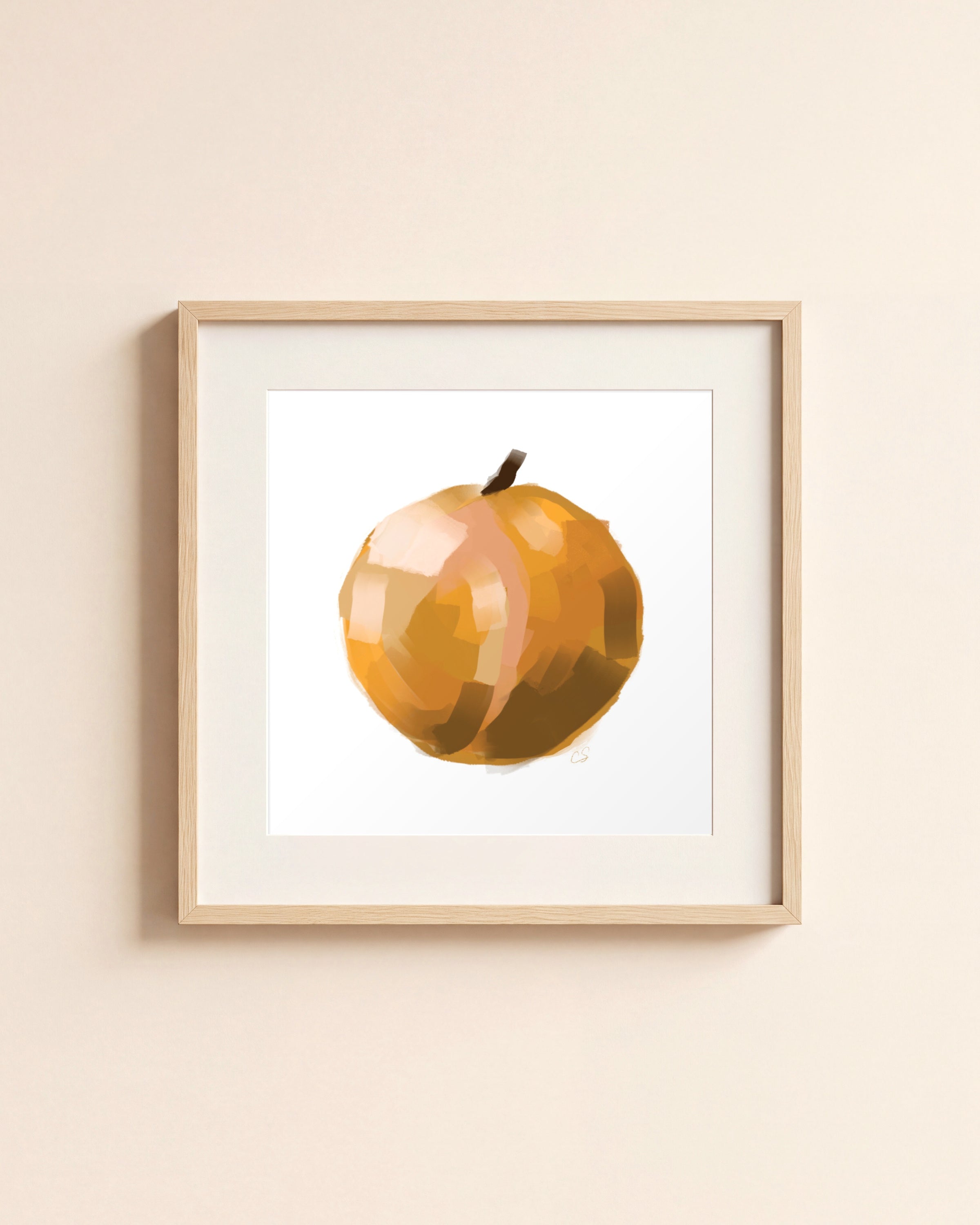 Orange giclée art print in a light oak frame with a white mat, hanging on a cream wall