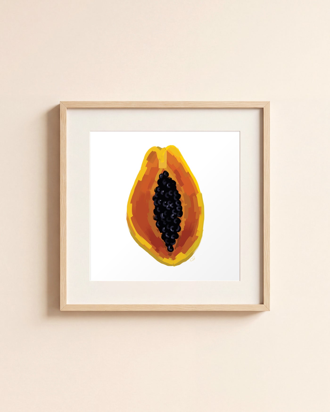 Papaya giclée art print in a light oak frame with a white mat, hanging on a cream wall