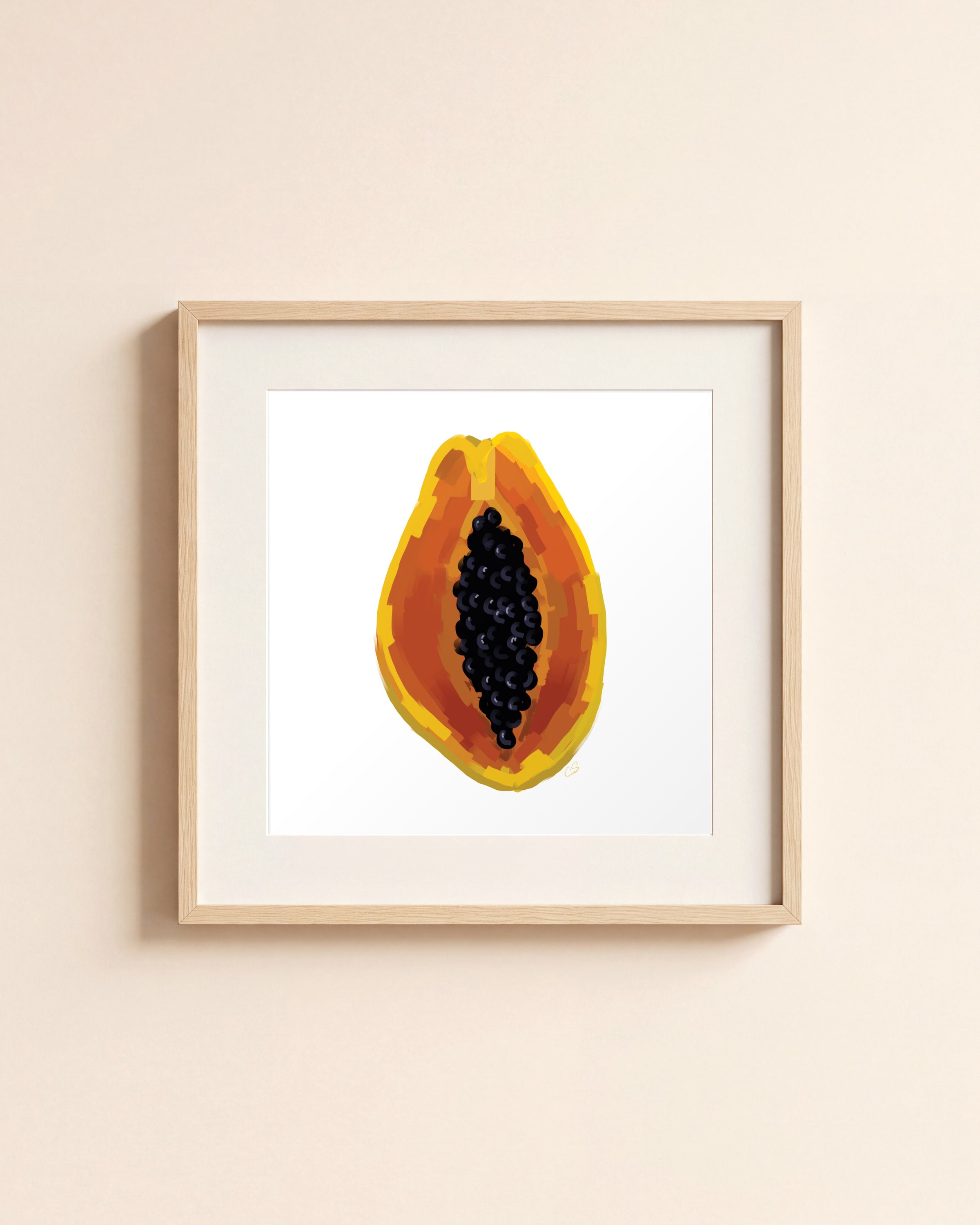 Papaya giclée art print in a light oak frame with a white mat, hanging on a cream wall