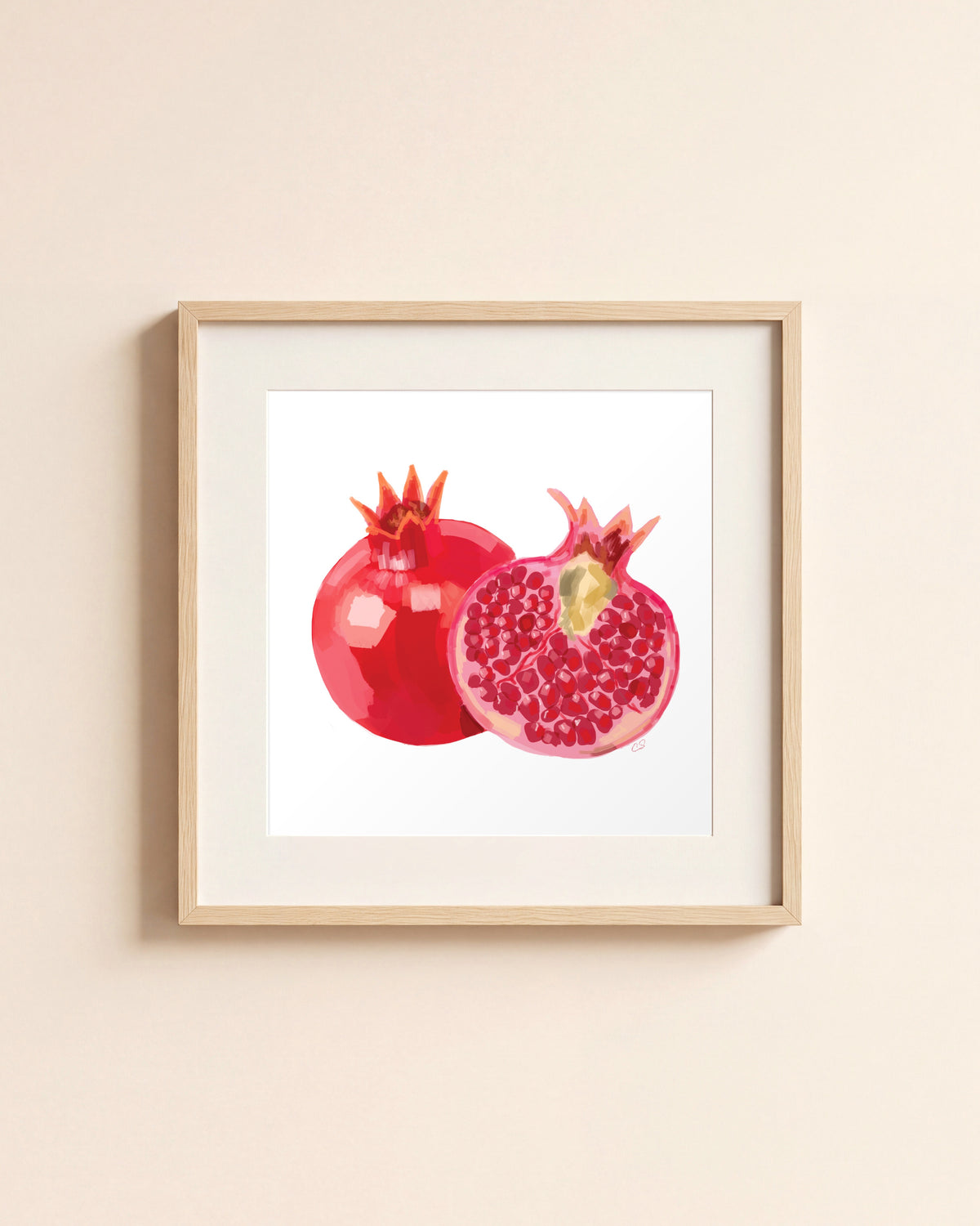 Pom giclée art print in a light oak frame with a white mat, hanging on a cream wall